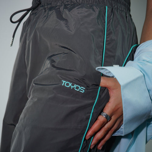 Pantalones de chándal verdes con raya lateral